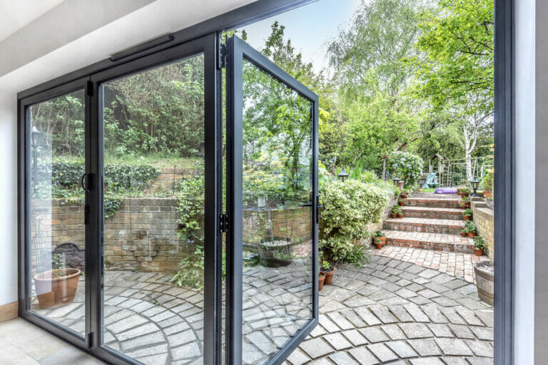 Three Counties installation of Visifold aluminium bi-fold doors, by Smart Architectural Aluminium.