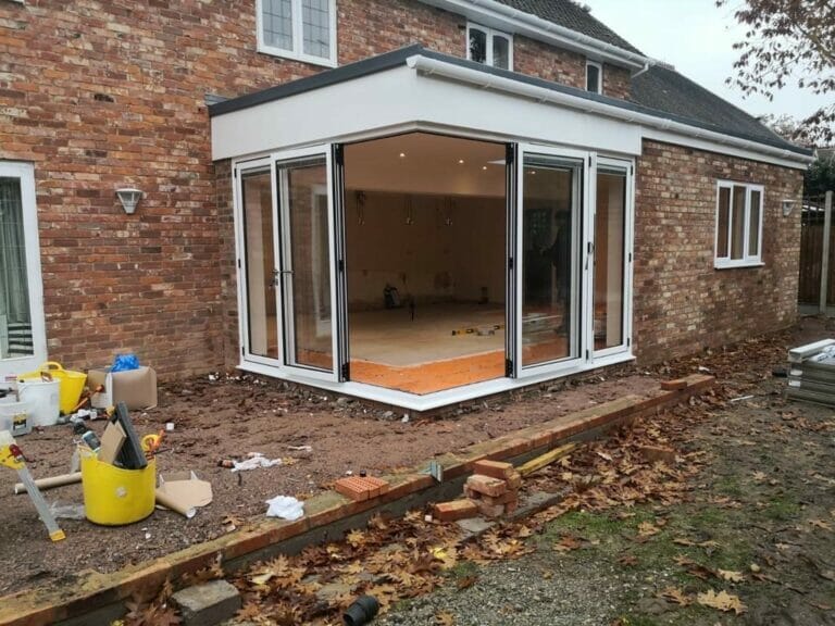 Origin aluminium corner door system - Three Counties installation of aluminium corner doors on conservatory.