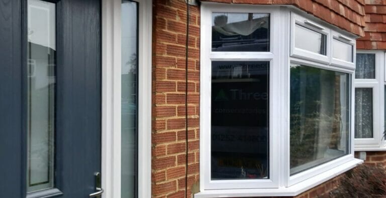 Replacement blue composite door and white upvc windows