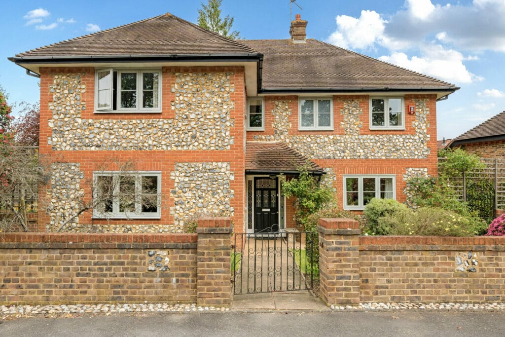 A curb view of a home installed with Agate Grey Flush Casement Windows. The image is the featured image of a Three Counties case study installation of windows and patio doors. Read our customer reviews and testimonials from checkatrade